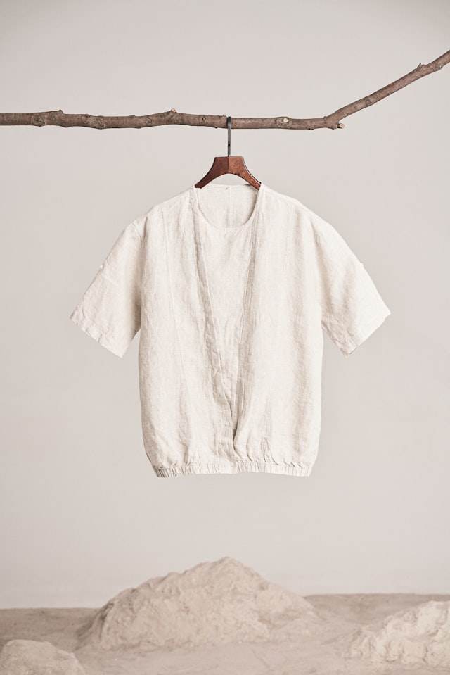 Cream linen shirt on a hanger